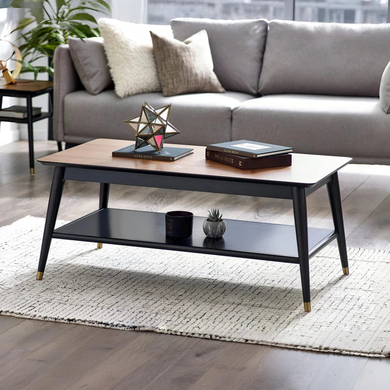 Coffee table with wooden top and black base on a white background