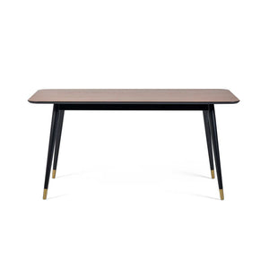 Rectangular table with black legs and gold accents on a white background