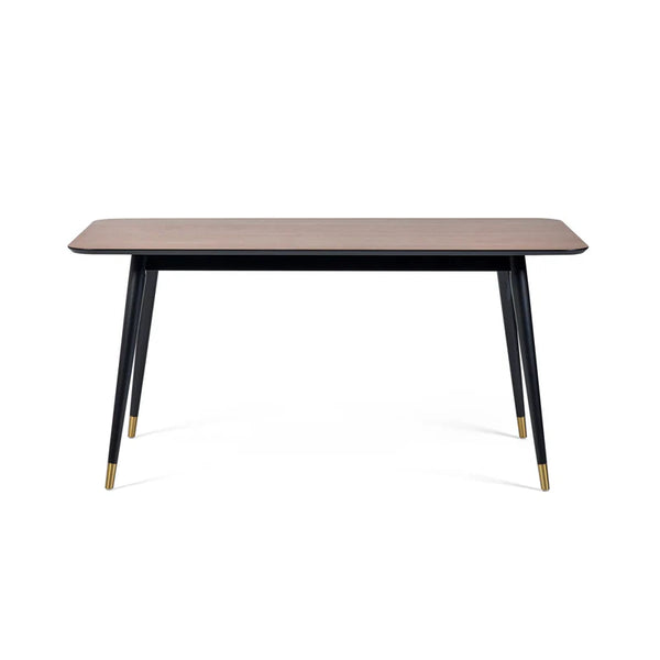 Rectangular table with black legs and gold accents on a white background