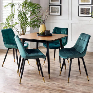 Dining room with a wooden table and teal chairs on a wooden floor.