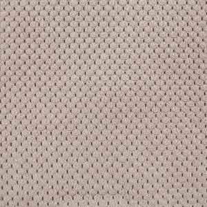 Textured beige material with a subtle pattern