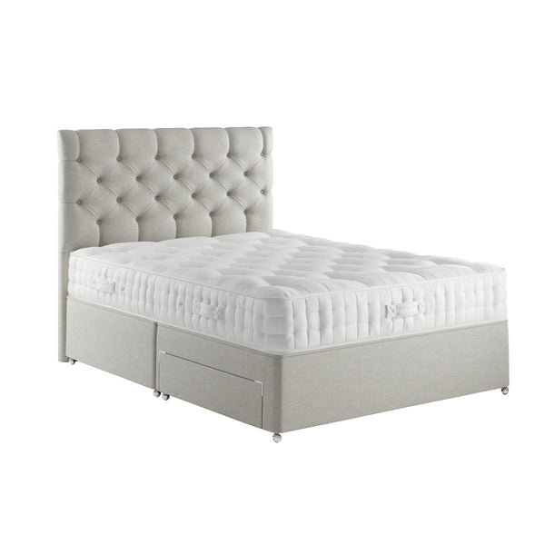 Gray upholstered bed with tufted headboard on a white background