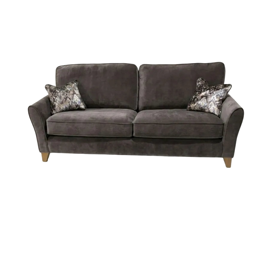 Gray sofa with patterned cushions on a white background