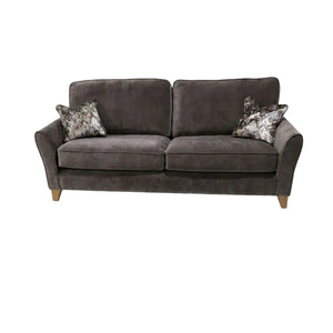Gray sofa with patterned cushions on a white background