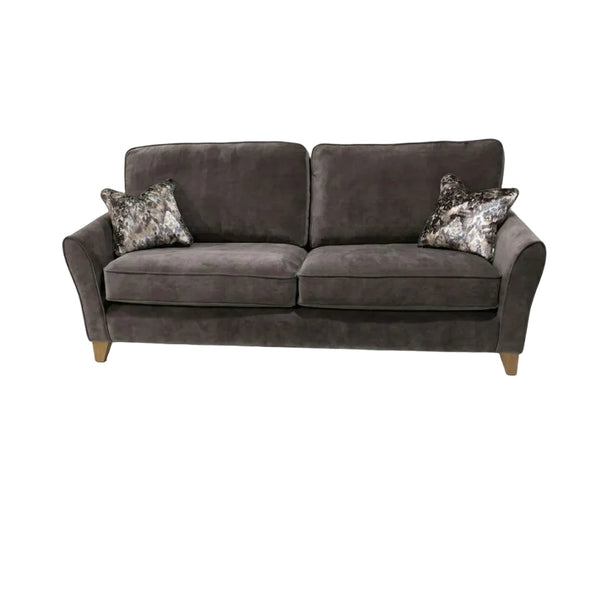 Gray sofa with patterned cushions on a white background