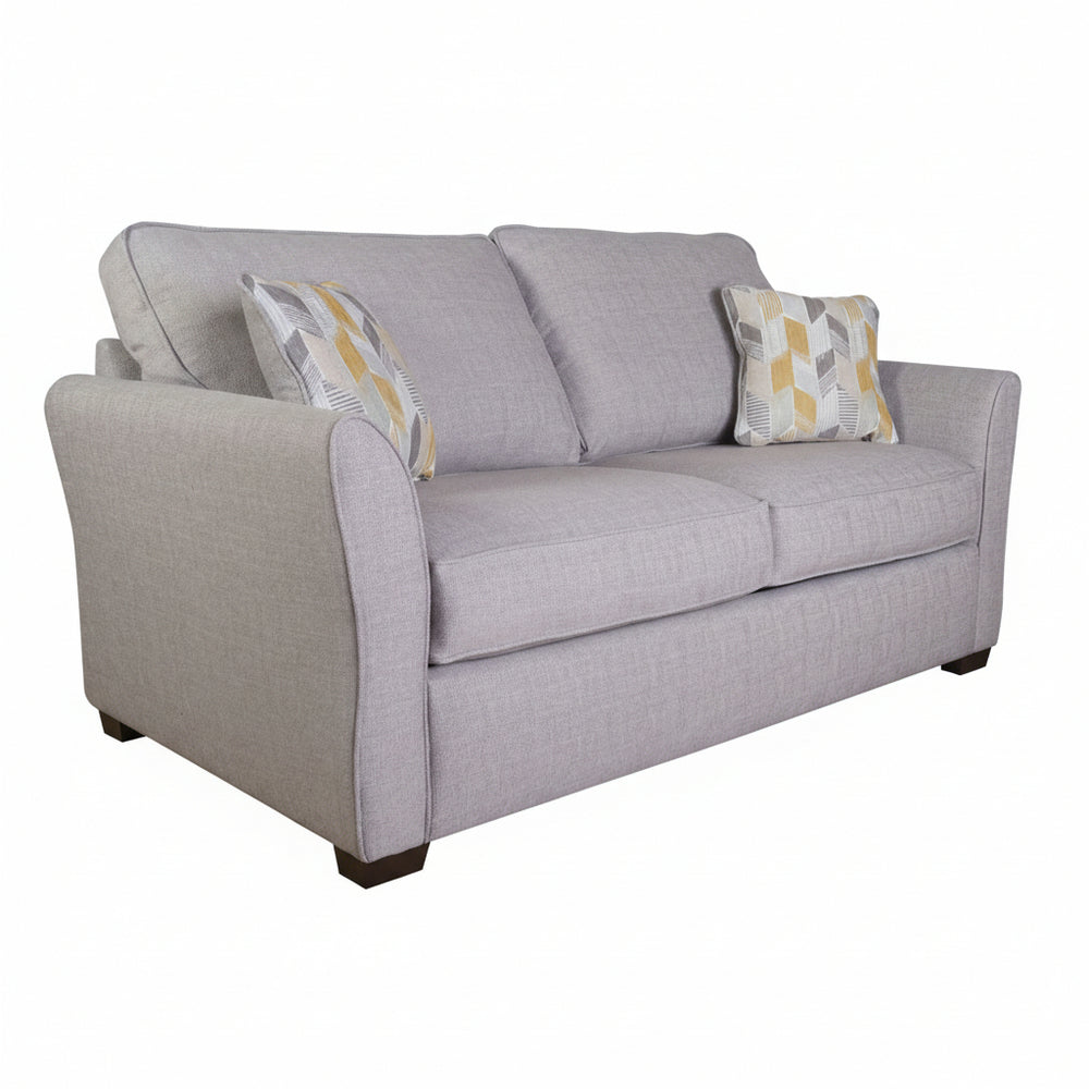 Gray sofa with patterned cushions on a white background