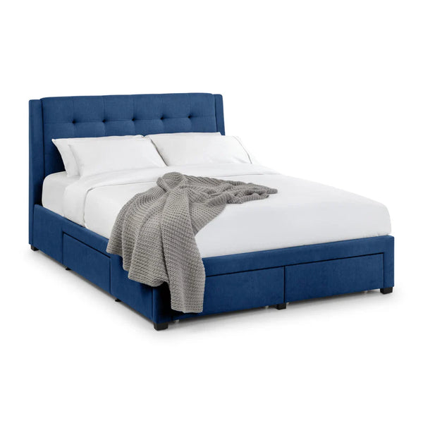 Blue upholstered bed with white mattress and gray blanket on a white background