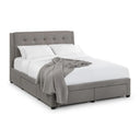 Gray upholstered bed with white bedding and a gray blanket on a white background