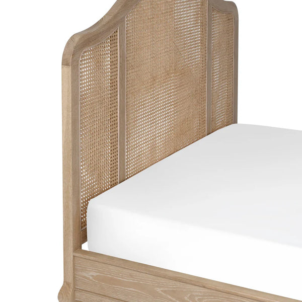 Wicker headboard with white mattress on a white background