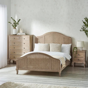 Bedroom with a wooden bed and matching nightstands.