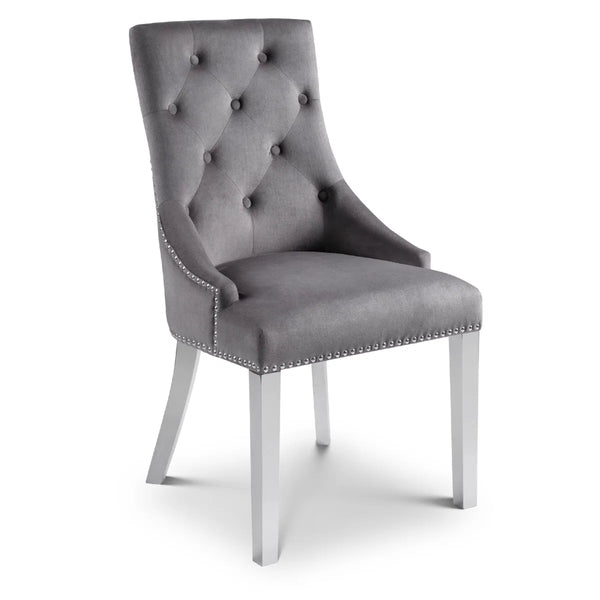 Gray upholstered chair with tufted backrest on a white background