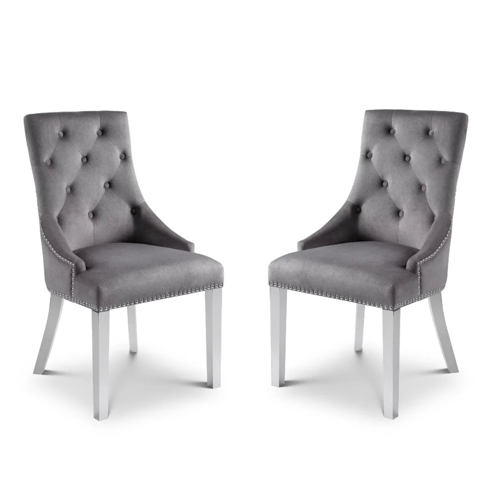 Two gray upholstered chairs with silver legs on a white background