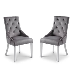 Two gray upholstered chairs with silver legs on a white background