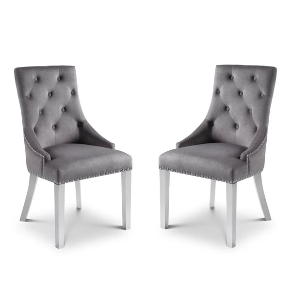 Two gray upholstered chairs with silver legs on a white background