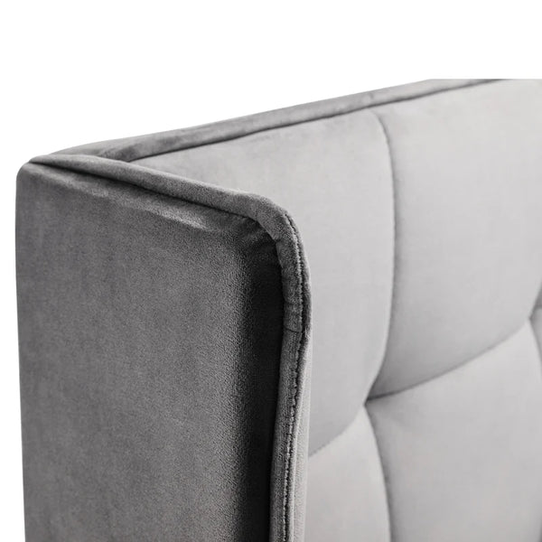 Gray upholstered headboard corner on a white background