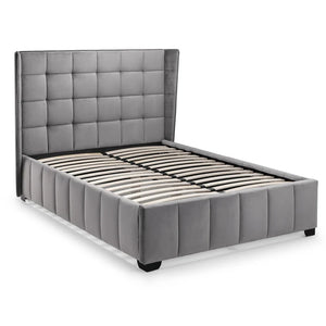 Gray upholstered bed with tufted headboard on a white background