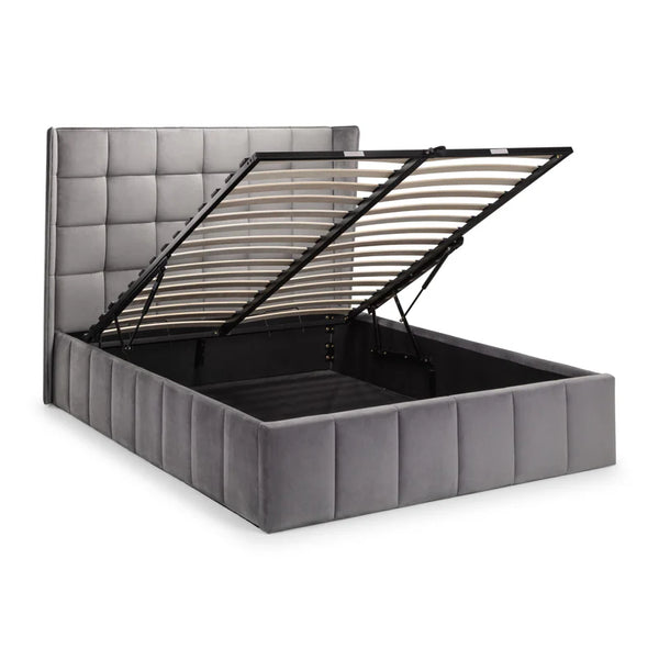 Gray upholstered bed with open headboard on a white background