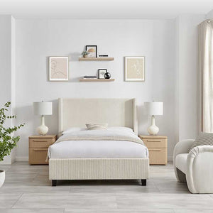Modern bedroom with a bed, nightstands, and lamps in a neutral color scheme.