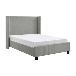 Gray upholstered bed with white mattress on a white background