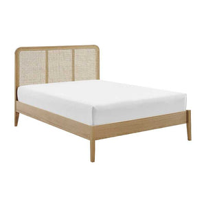 Wooden bed frame with woven headboard and white mattress on a white background