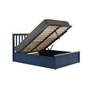 Blue bed frame with storage compartment on a white background