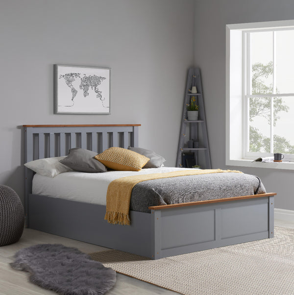 Gray bed with wooden accents in a bedroom setting