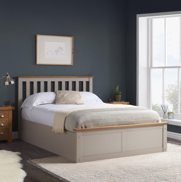 Bedroom with a wooden bed frame, nightstands, and a window.