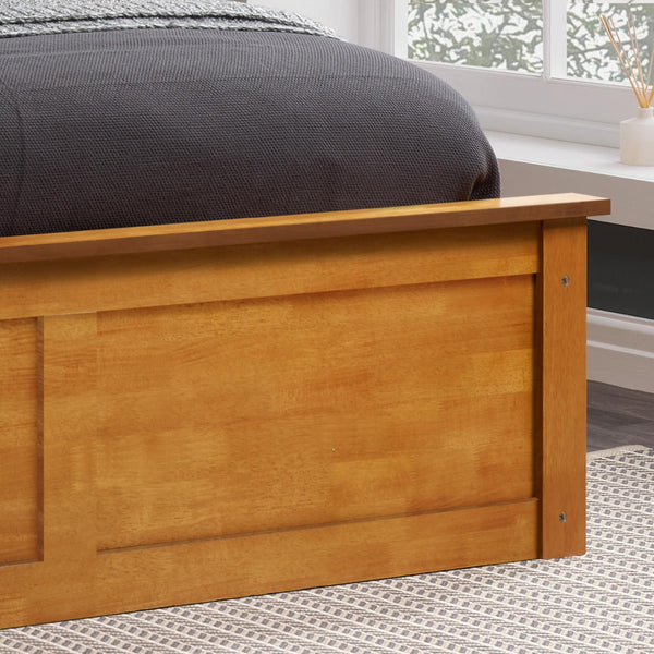 Wooden bed frame with a bed in a room with a window and rug.