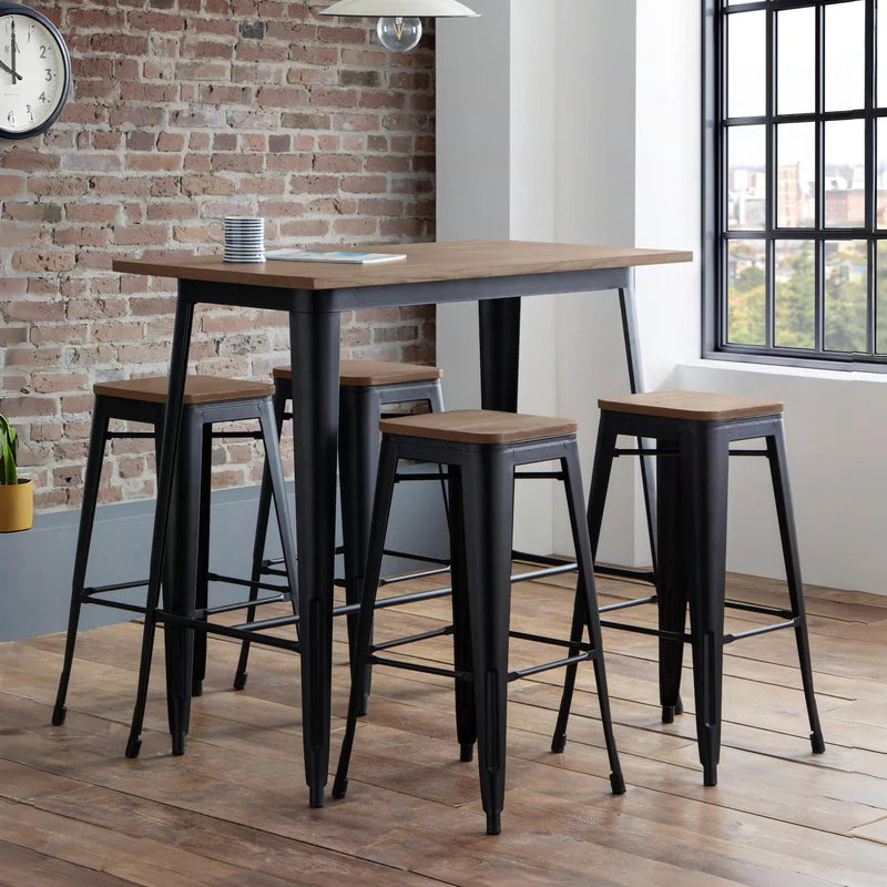 Table with wooden top and black metal legs on a white background