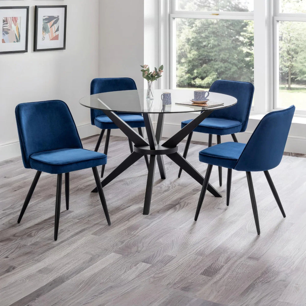Two blue chairs with black legs on a white background