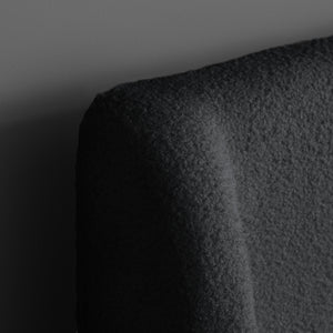 Close-up of a textured black surface with a gradient background