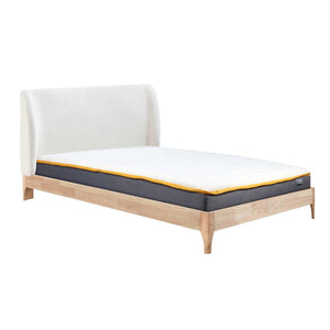 Bed with white headboard and wooden frame on a white background