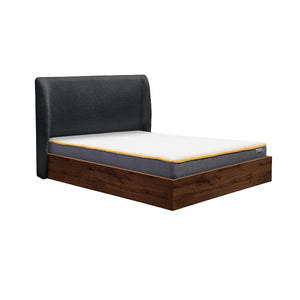 Bed with black upholstered headboard and wooden frame on a white background