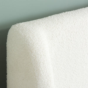Close-up of a white textured material against a gray background