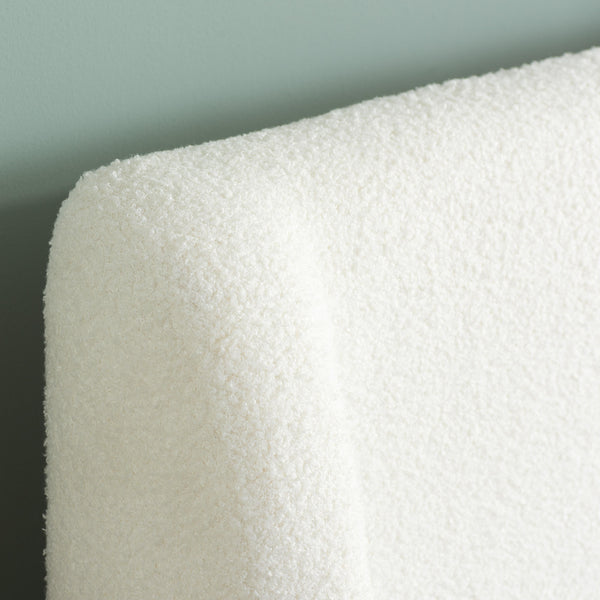 Close-up of a white textured material against a gray background