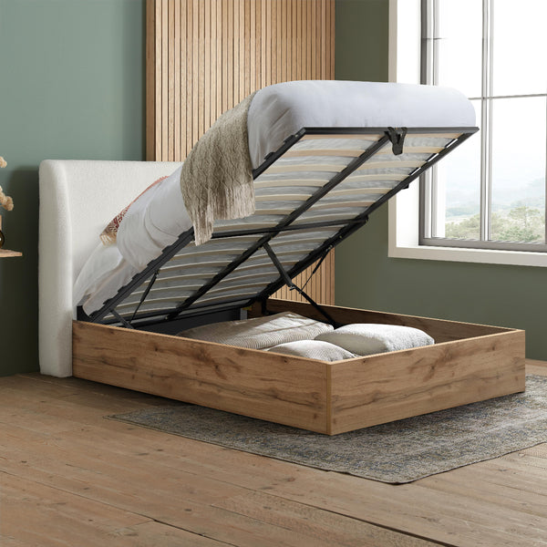 Wooden bed with storage compartment in a room with a window and rug.