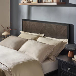 Bedroom with a bed featuring beige bedding and a dark headboard, nightstands with decorative items.
