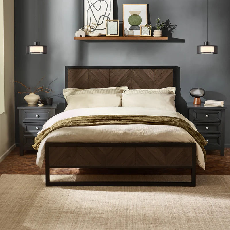 Bed with wooden headboard and metal frame on a white background
