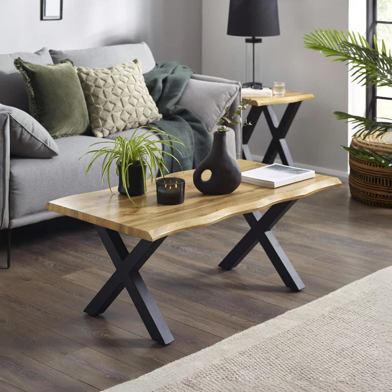 Wooden table with black metal legs on a white background