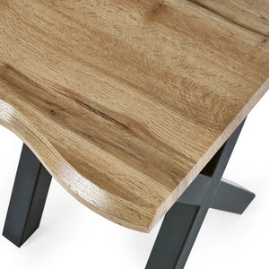 Wooden table with black metal legs on a white background