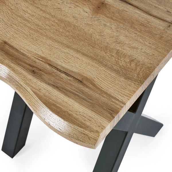 Wooden table with black metal legs on a white background