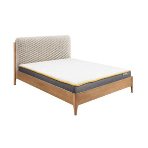 Bed with wooden frame, textured headboard, and mattress on a white background
