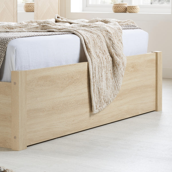 Wooden bed with beige blanket in a minimalistic room