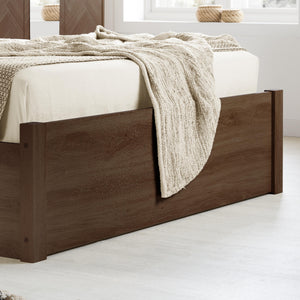 Wooden bed with beige blanket in a minimalistic room