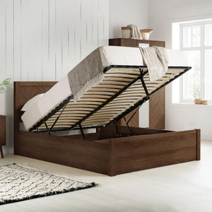 Wooden bed frame with storage compartment in a bedroom setting