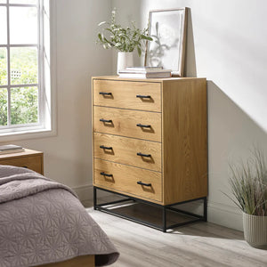 Humber 4 drawer chest in a bedroom setting with plant