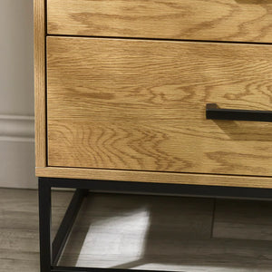 Wooden drawer with metal handle on a wooden floor