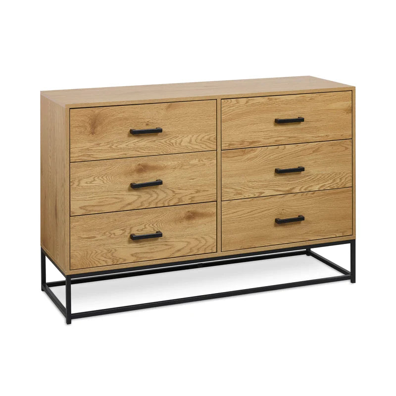 Wooden dresser with four drawers and black metal legs on a white background