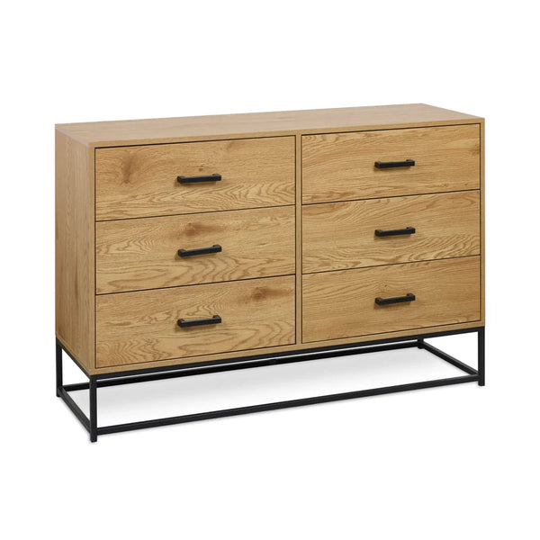 Wooden dresser with four drawers and black metal legs on a white background