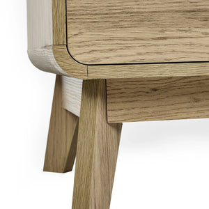 Close-up of a wooden side table with a white background